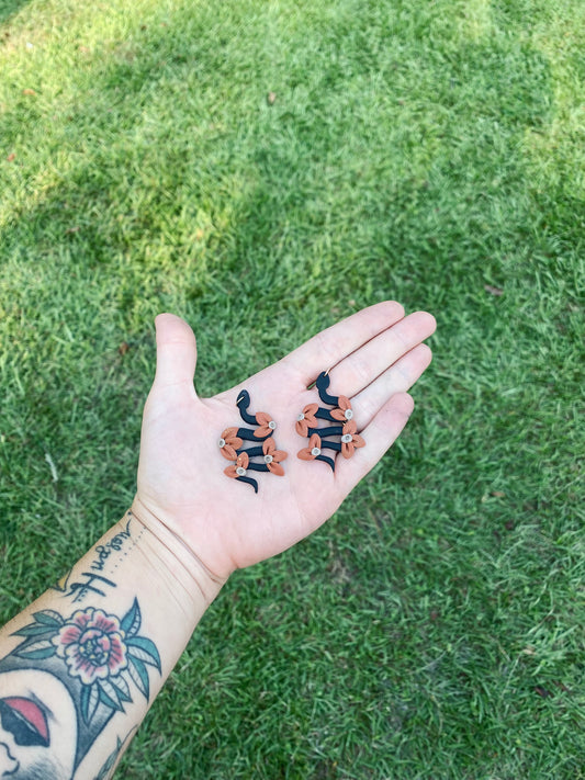 Floral snake earrings