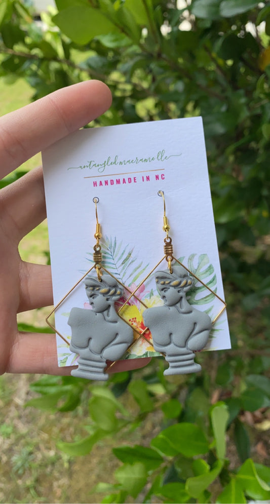 Golden statue earrings